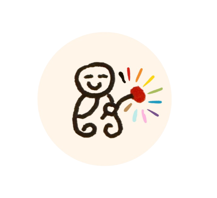 small buddah with a rainbow flower