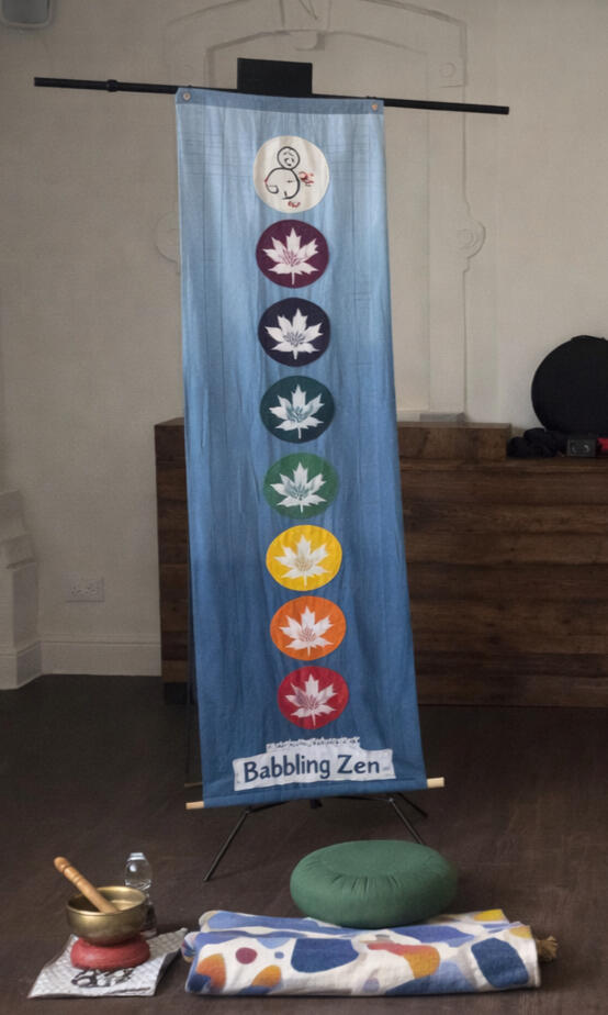 Image from a past event A BabblingZen Chakra Banner with a Zafu set up for meditation