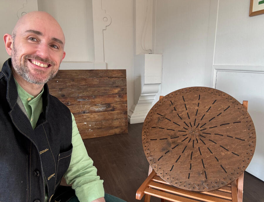 A BabblingZen Chakra Banner with a Zafu set up for meditation